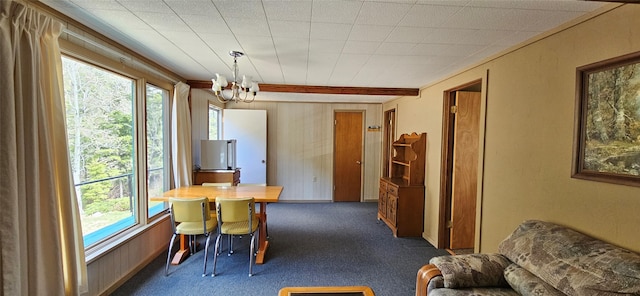 11169 Stemple Pass Rd, Lincoln, MT 59639 - dining area featuring carpet and a chandelier