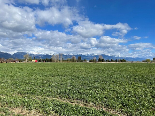 view of mountain backdrop featuring rural landscape