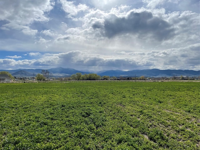 view of mountain background featuring rural landscape