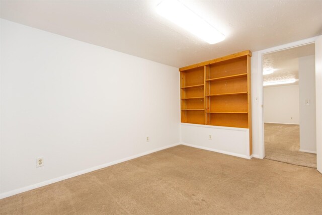 433 N 10th Ave, Bozeman, MT 59715 - empty room featuring carpet floors, baseboards, and built in features