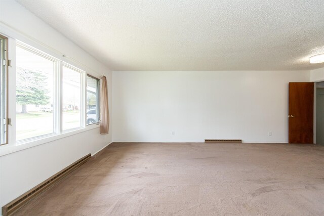 433 N 10th Ave, Bozeman, MT 59715 - empty room featuring a textured ceiling and carpet flooring