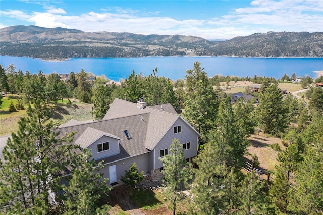 view of subject property featuring a water and mountain view
