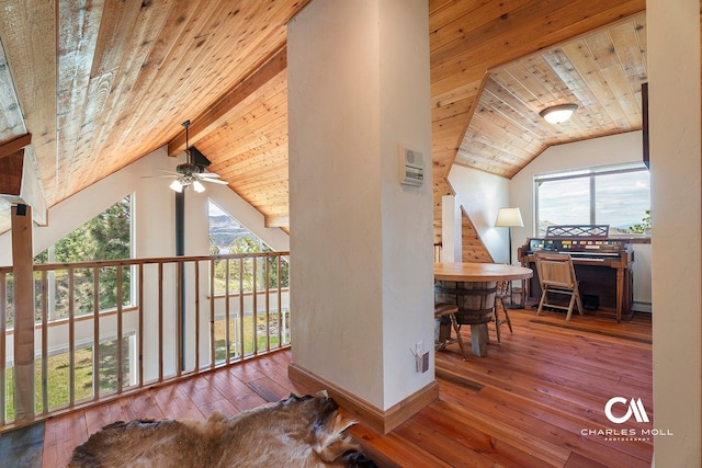 bonus room featuring ceiling fan, wooden ceiling, hardwood / wood-style floors, a baseboard heating unit, and baseboards