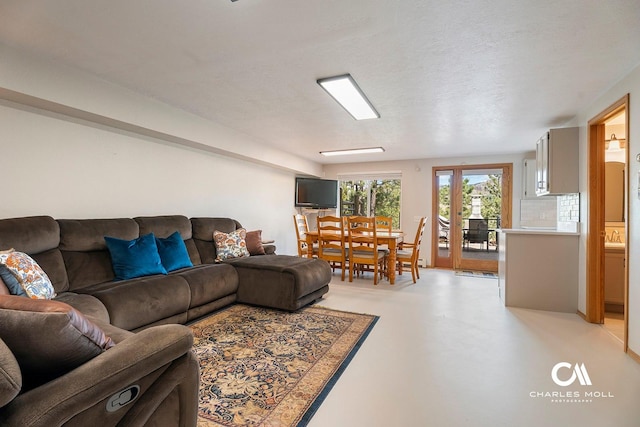 living room with concrete flooring