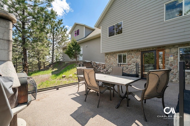 view of patio / terrace with outdoor dining area and fence