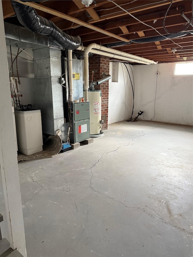 basement with gas water heater and heating unit