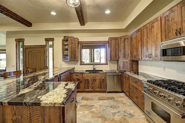 45292 Locust Ln, Charlo, MT 59824 - kitchen featuring stainless steel appliances, a textured ceiling, a sink, beam ceiling, and recessed lighting