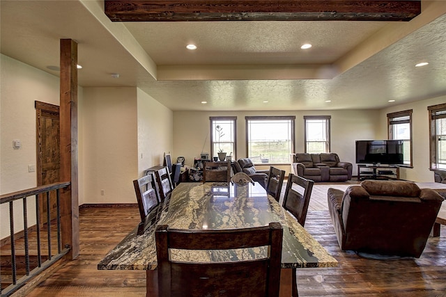 45292 Locust Ln, Charlo, MT 59824 - dining area featuring dark wood-style flooring, a textured ceiling, a tray ceiling, recessed lighting, and baseboards