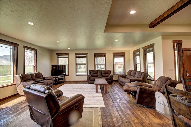 45292 Locust Ln, Charlo, MT 59824 - living room featuring a textured ceiling, recessed lighting, dark wood-type flooring, baseboards, and beamed ceiling
