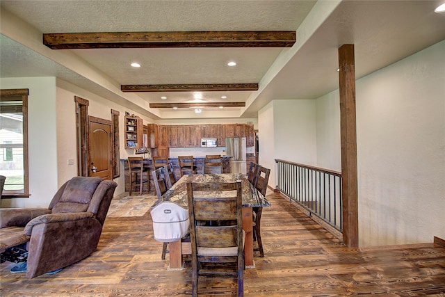 45292 Locust Ln, Charlo, MT 59824 - dining space featuring dark wood-style floors, beam ceiling, and recessed lighting