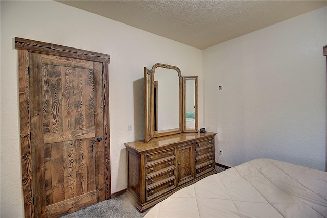 45292 Locust Ln, Charlo, MT 59824 - carpeted bedroom with baseboards and a textured ceiling