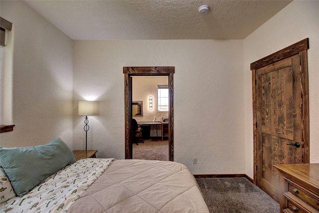 45292 Locust Ln, Charlo, MT 59824 - bedroom featuring carpet floors, baseboards, and a textured ceiling