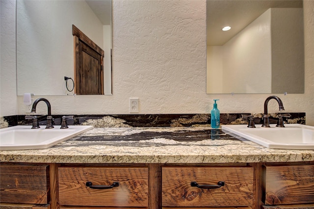 45292 Locust Ln, Charlo, MT 59824 - bathroom featuring a textured wall and double vanity