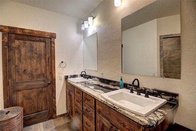 45292 Locust Ln, Charlo, MT 59824 - bathroom with a textured wall, double vanity, and stone finish flooring