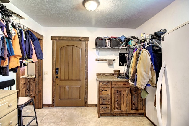 45292 Locust Ln, Charlo, MT 59824 - spacious closet with a sink and light tile patterned floors