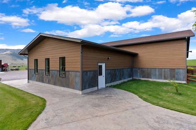 45292 Locust Ln, Charlo, MT 59824 - view of side of home with a patio area and a mountain view