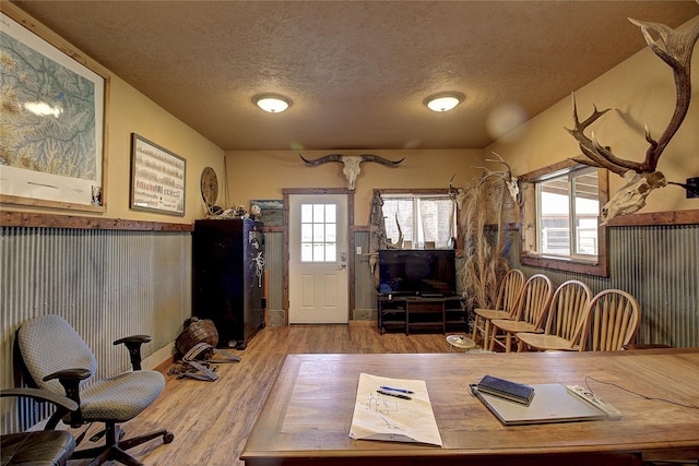 45292 Locust Ln, Charlo, MT 59824 - home office featuring a textured ceiling, wood finished floors, and a wainscoted wall
