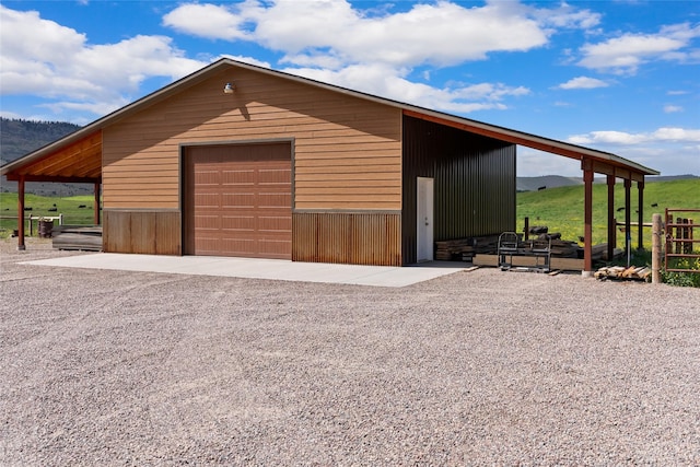 45292 Locust Ln, Charlo, MT 59824 - garage featuring a garage and gravel driveway