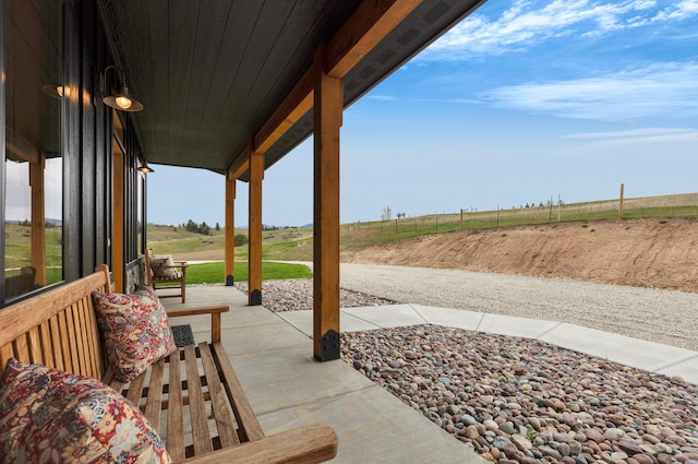 559 Stage Springs Ln, Stevensville, MT 59870 - view of patio featuring covered porch and a view of countryside