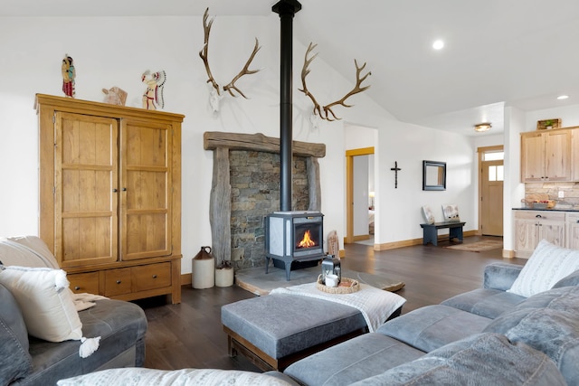 559 Stage Springs Ln, Stevensville, MT 59870 - living room with a wood stove, dark wood-style floors, lofted ceiling, baseboards, and recessed lighting