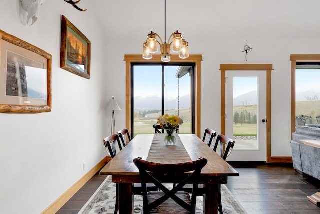 559 Stage Springs Ln, Stevensville, MT 59870 - dining area with a chandelier, dark wood-style floors, and baseboards