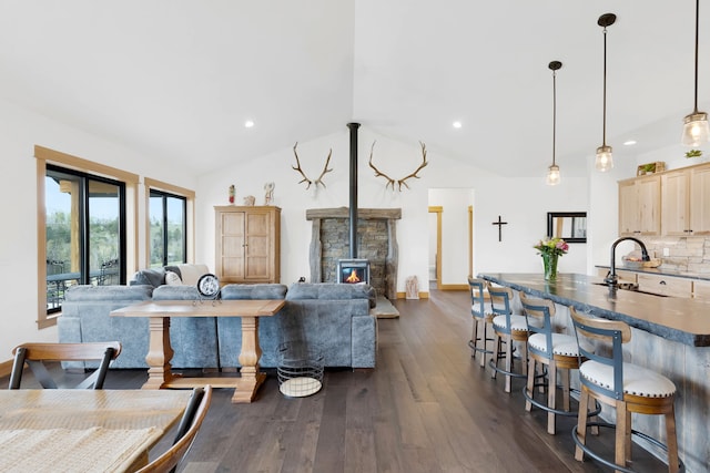 559 Stage Springs Ln, Stevensville, MT 59870 - dining area with dark wood-style floors, lofted ceiling, and recessed lighting