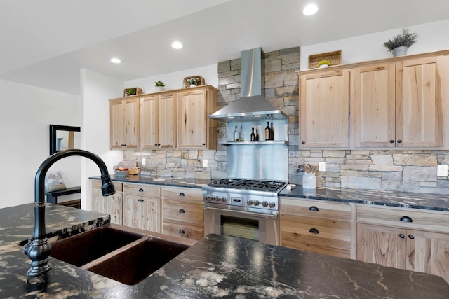 559 Stage Springs Ln, Stevensville, MT 59870 - kitchen with light brown cabinetry, ventilation hood, high end range, a sink, and backsplash
