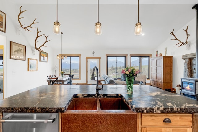 559 Stage Springs Ln, Stevensville, MT 59870 - kitchen featuring open floor plan, a sink, a wood stove, and healthy amount of natural light