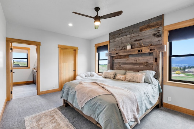 559 Stage Springs Ln, Stevensville, MT 59870 - bedroom with carpet flooring, baseboards, multiple windows, and recessed lighting