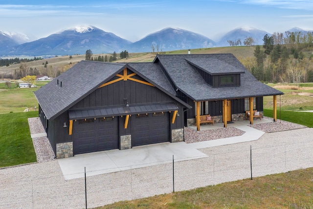 559 Stage Springs Ln, Stevensville, MT 59870 - view of front facade with stone siding, board and batten siding, and a mountain view