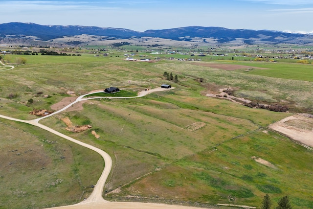 559 Stage Springs Ln, Stevensville, MT 59870 - aerial overview of property's location with a mountainous background and rural landscape