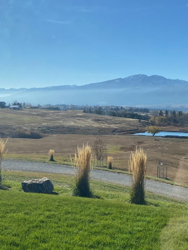559 Stage Springs Ln, Stevensville, MT 59870 - view of mountain backdrop featuring rural landscape and a nearby body of water