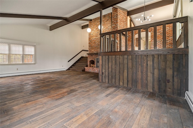 unfurnished living room with a chandelier, wood-type flooring, baseboard heating, and stairs