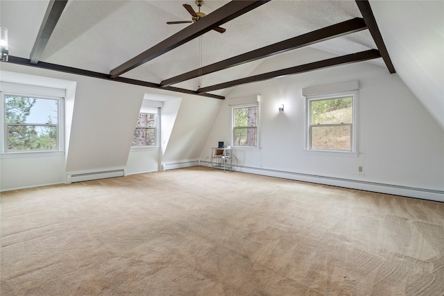 additional living space featuring a baseboard radiator, carpet flooring, ceiling fan, and healthy amount of natural light