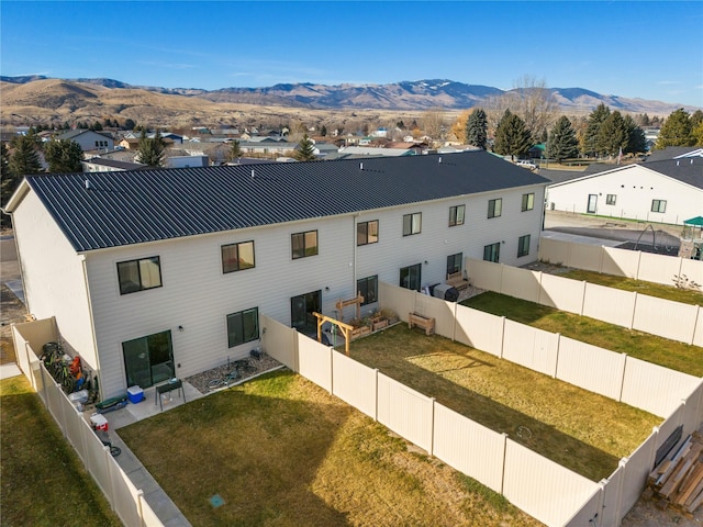 aerial perspective of suburban area featuring a mountainous background