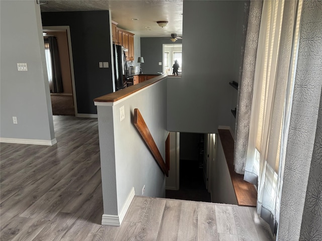 307 S Iowa St, Conrad, MT 59425 - stairway with wood finished floors, baseboards, and a ceiling fan