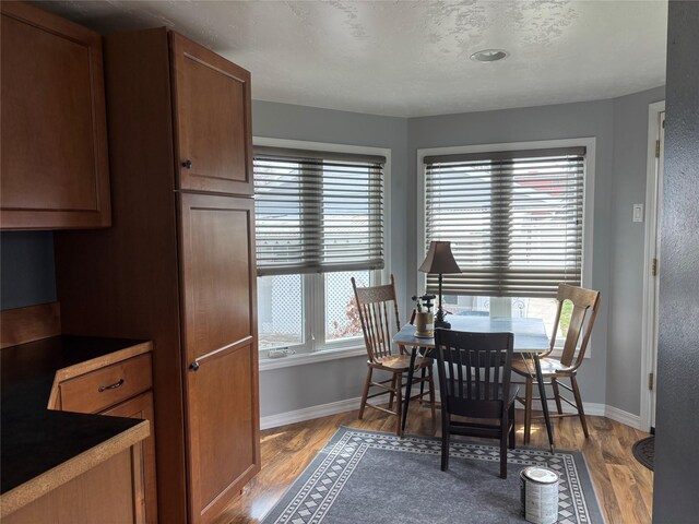 307 S Iowa St, Conrad, MT 59425 - dining space with baseboards and wood finished floors