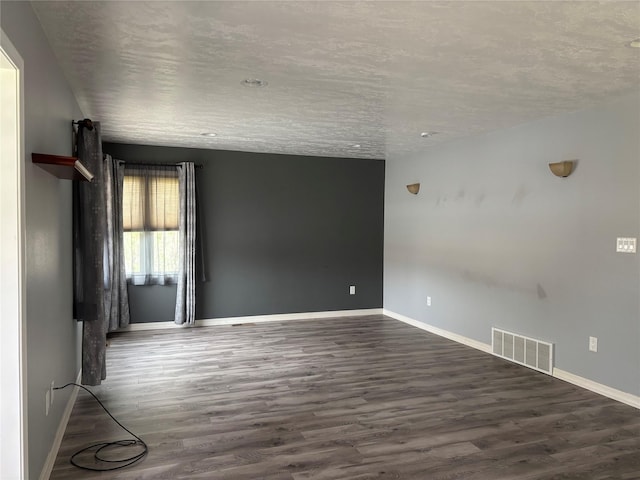 307 S Iowa St, Conrad, MT 59425 - spare room with wood finished floors and baseboards