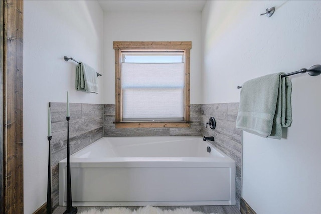 bathroom with a garden tub