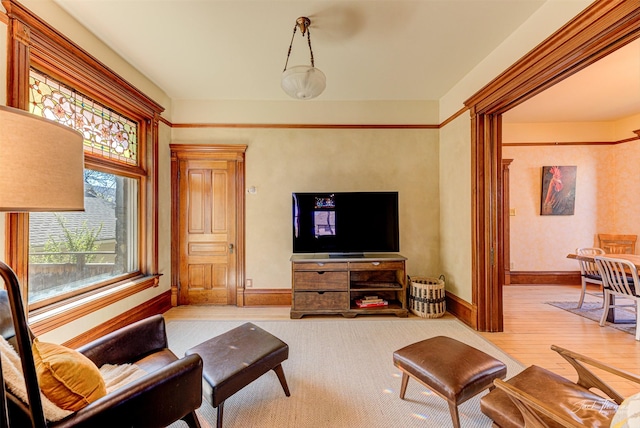 living room with wood finished floors and baseboards
