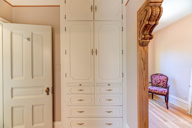 detailed view of baseboards and wood finished floors