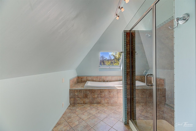 full bath featuring a stall shower, a bath, lofted ceiling, and tile patterned flooring