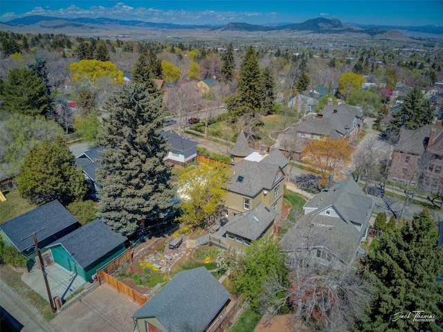 view of property location with nearby suburban area and a mountainous background