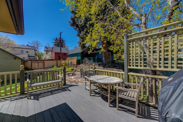 deck featuring fence and outdoor dining area