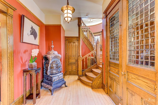 entrance foyer with hardwood / wood-style floors and stairway