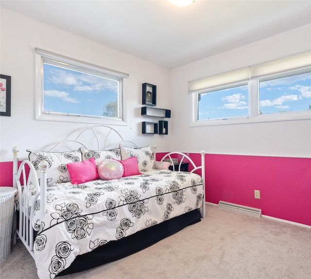 carpeted bedroom featuring a baseboard radiator
