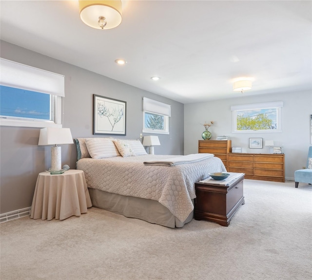 bedroom with carpet, multiple windows, baseboards, and recessed lighting