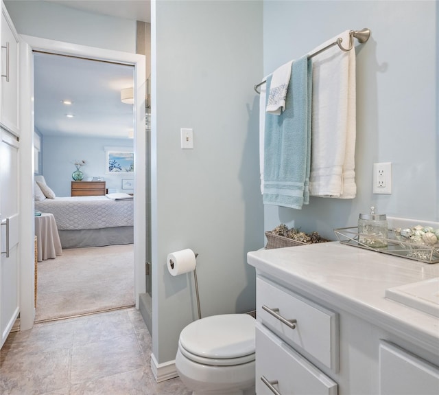 ensuite bathroom with toilet and vanity