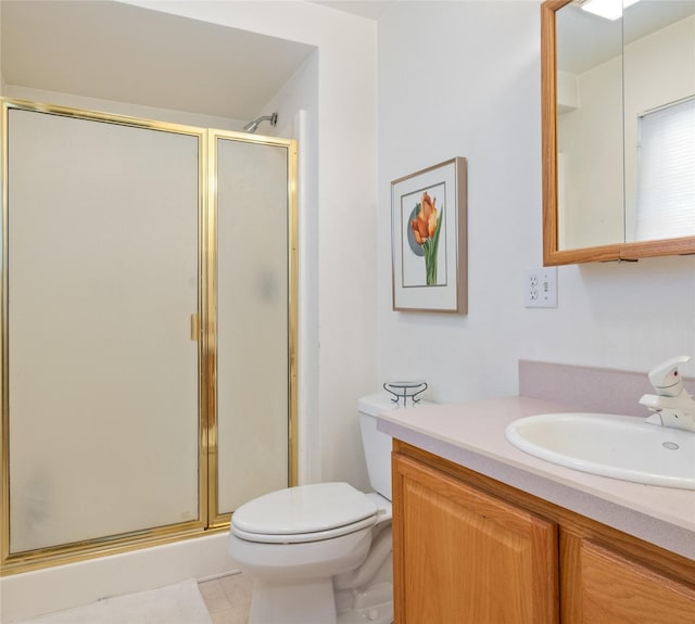 full bath with a shower stall, vanity, and toilet