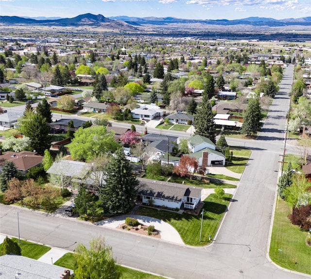 aerial view of residential area featuring a mountainous background